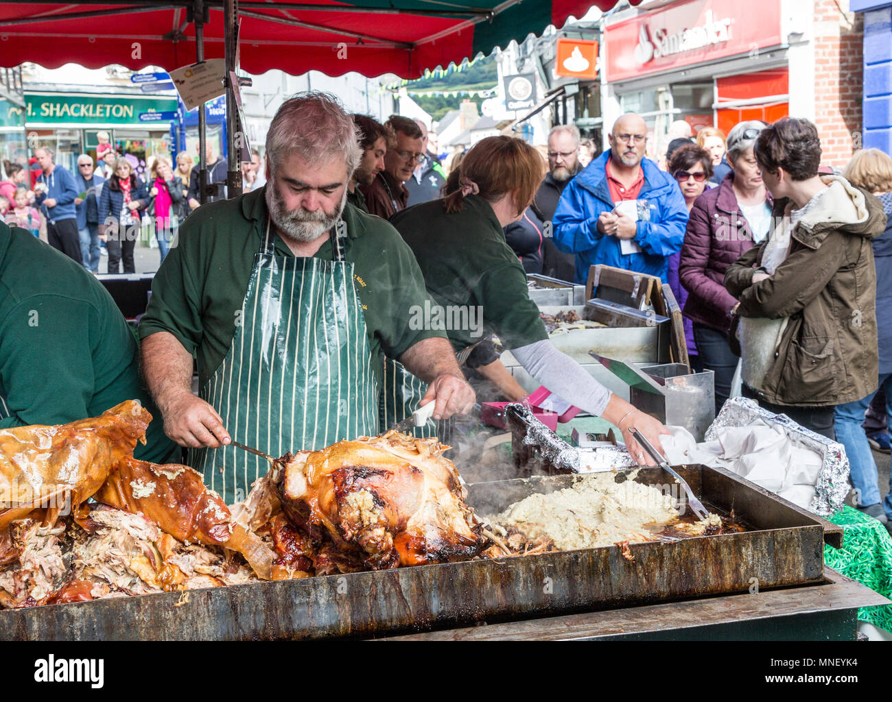 Rôti de sculpture à port market stall dans street, Abergavenny Food Festival, Pays de Galles, Royaume-Uni Banque D'Images