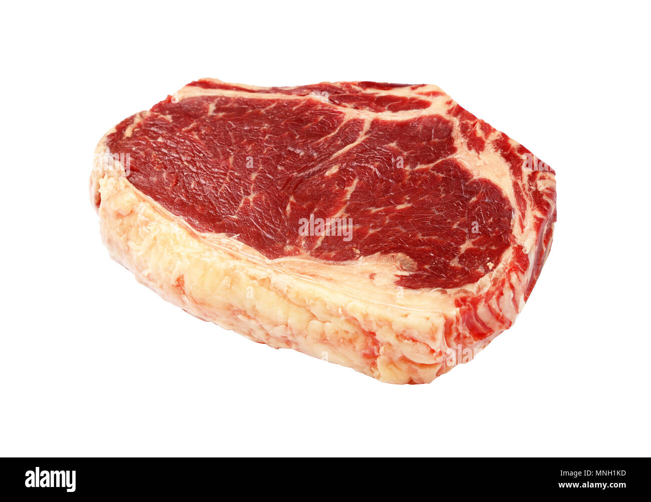 Close up one raw Ribeye Steak de boeuf avec os thoracique isolé sur fond blanc, high angle view Banque D'Images