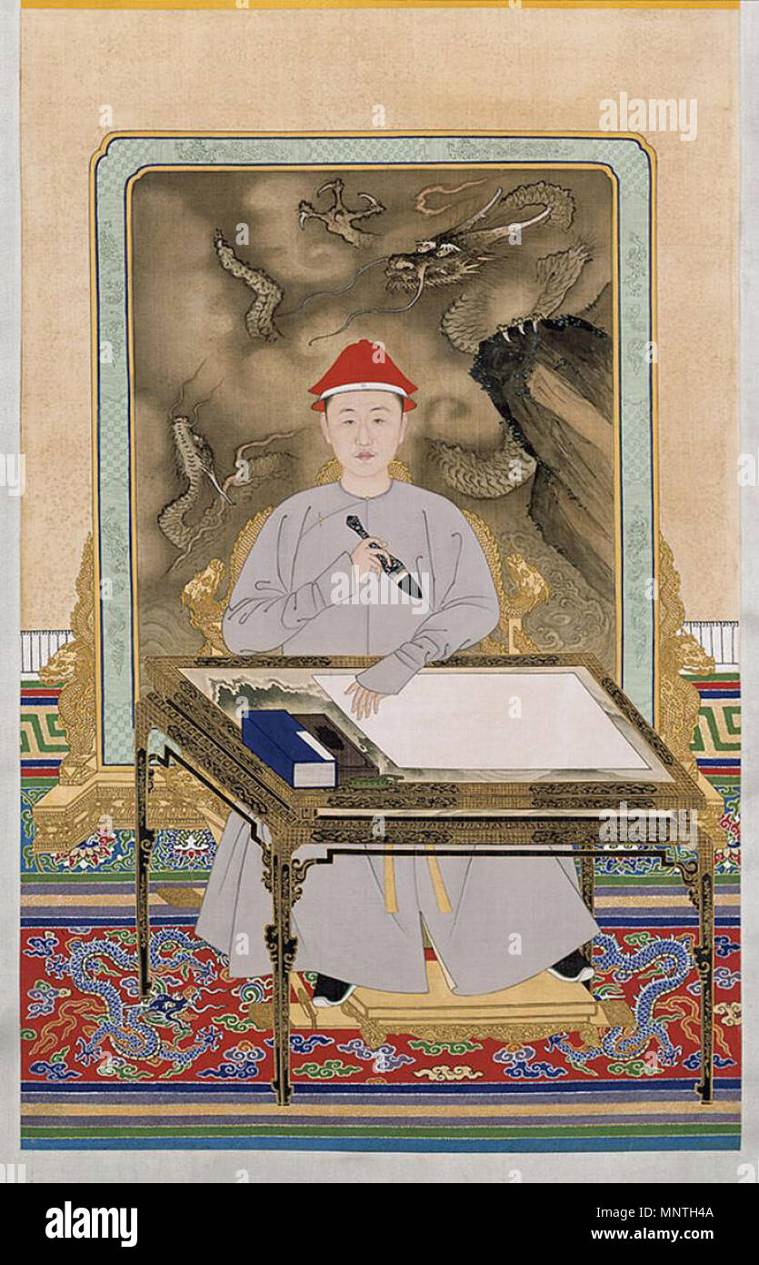 Portrait de l'Empereur Kangxi en robe informelle tenant un pinceau. Portrait de l'Empereur Kangxi en robe informelle tenant un pinceau . Période Kangxi (1662-1722). 1022 Portrait de l'Empereur Kangxi en robe informelle tenue un pinceau Banque D'Images