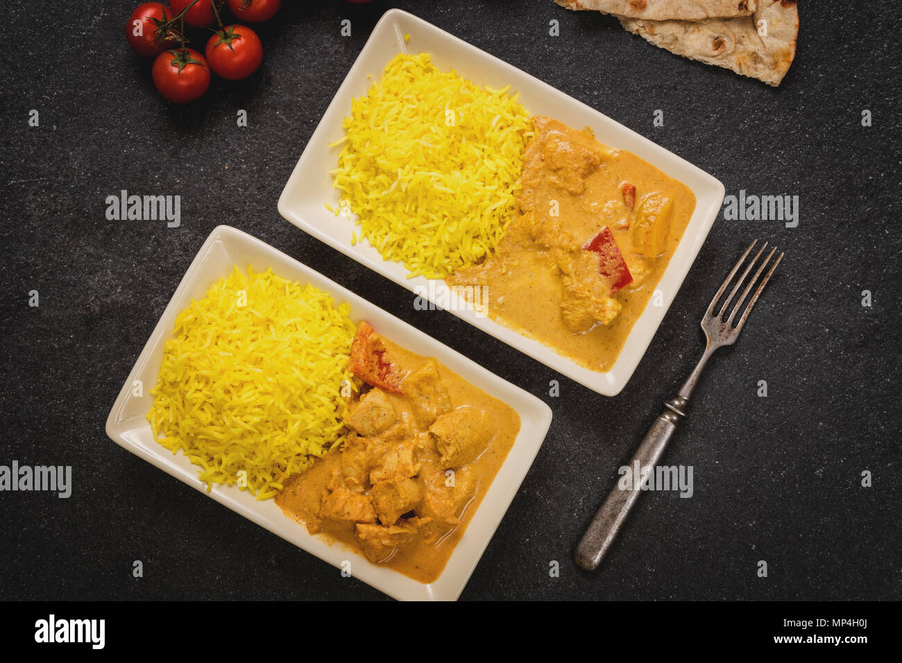 Beurre masala poulet avec riz au jasmin et chapati Banque D'Images