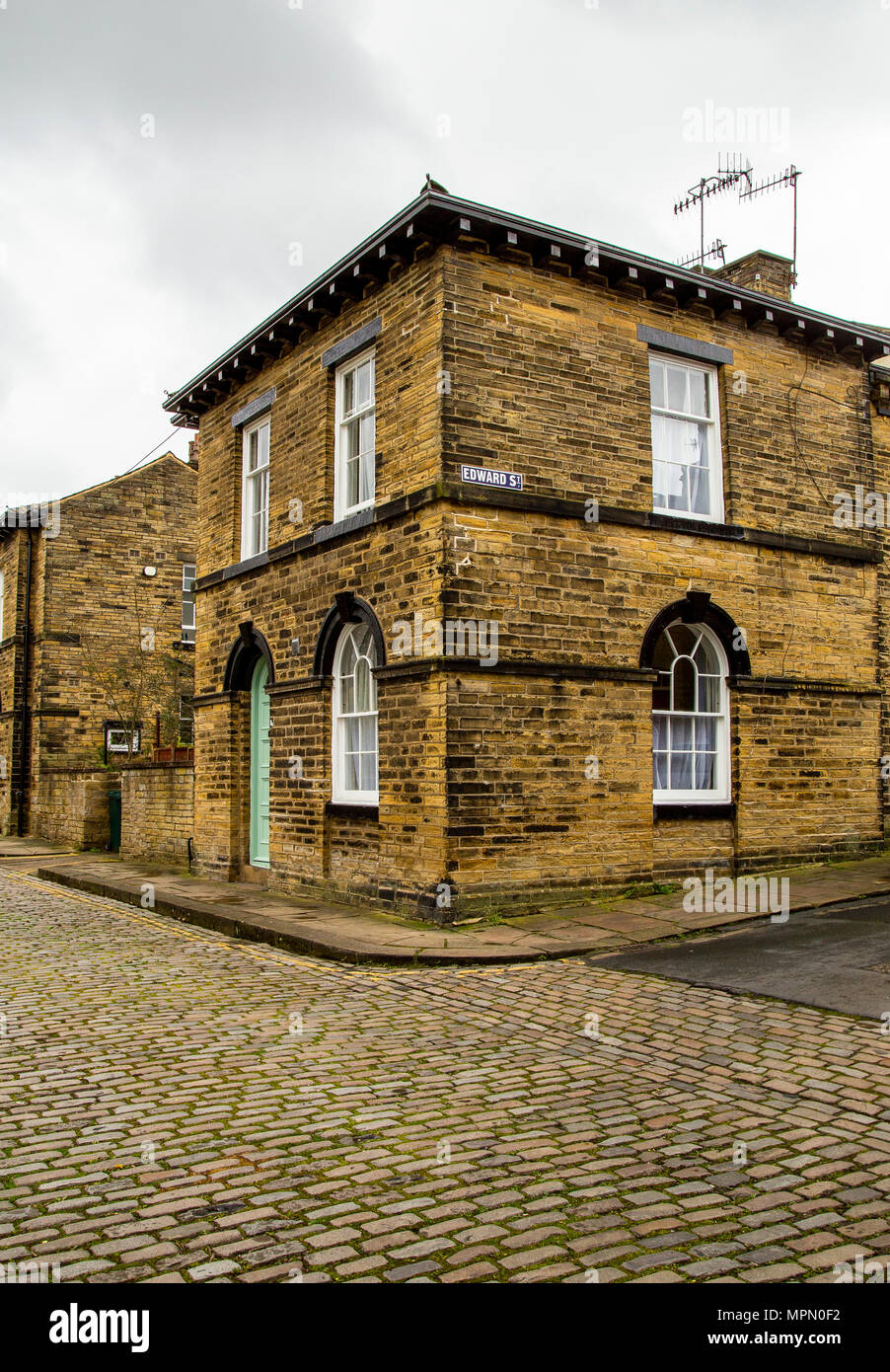 Rues pavées du village de Saltaire West Yorkshire. Saltaire est un site du patrimoine mondial de l'UNESCO a désigné. Banque D'Images