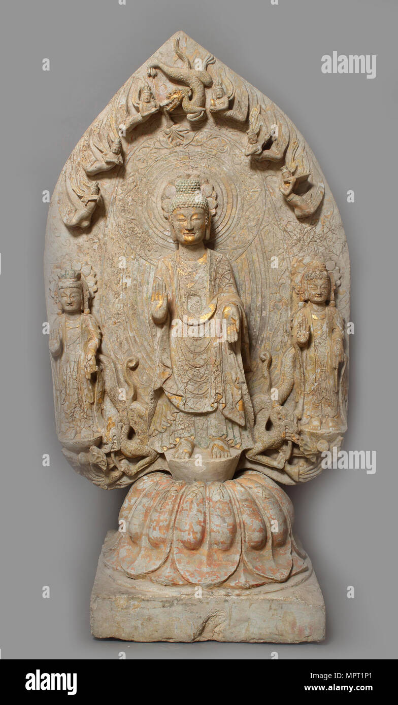Stèle votive avec Bouddha et deux Bodhisattvas, 534-550. Banque D'Images