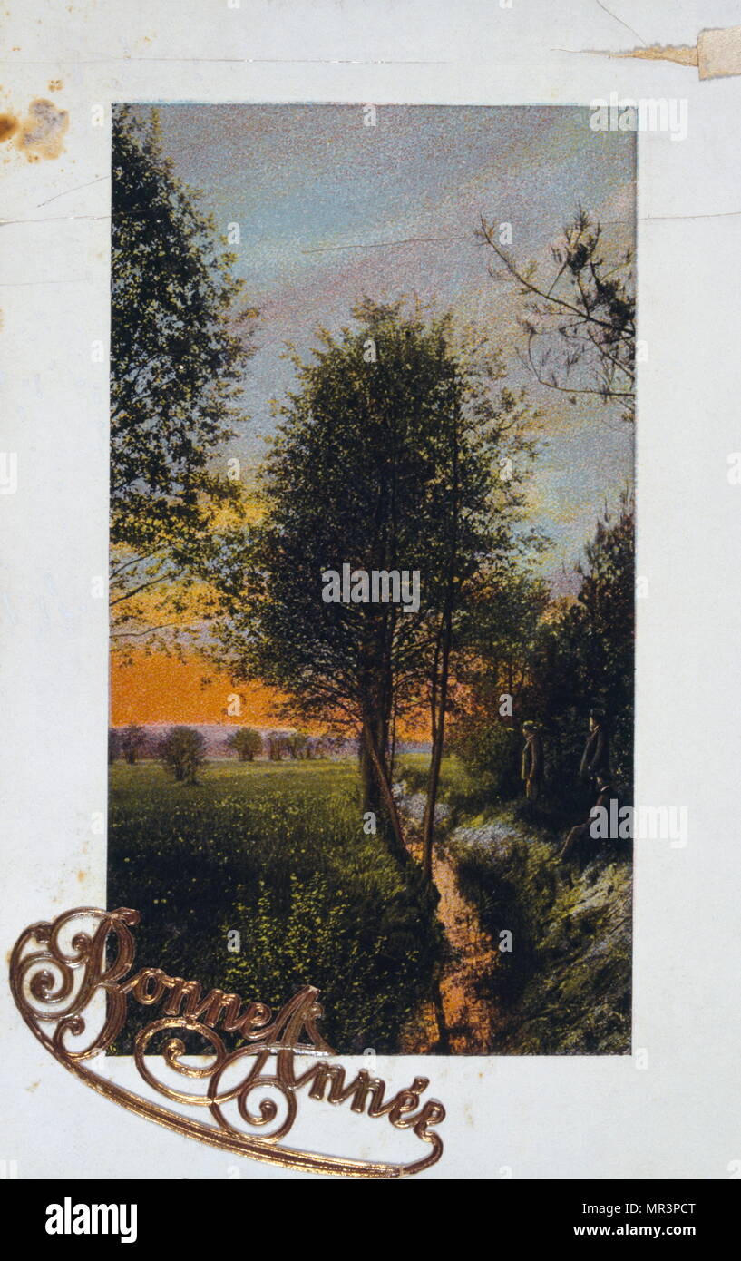Le Français Bonne Année, carte postale représentant un coucher du soleil contre les arbres. 1900 Banque D'Images