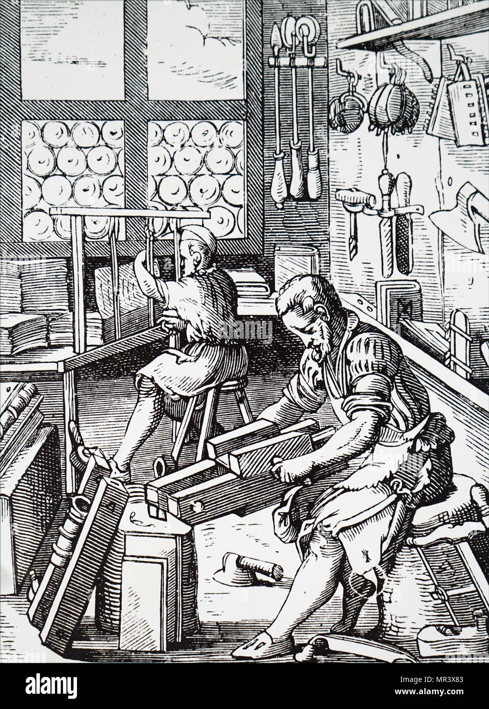 Gravure sur bois représentant un atelier du relieur. En date du 16e siècle Banque D'Images