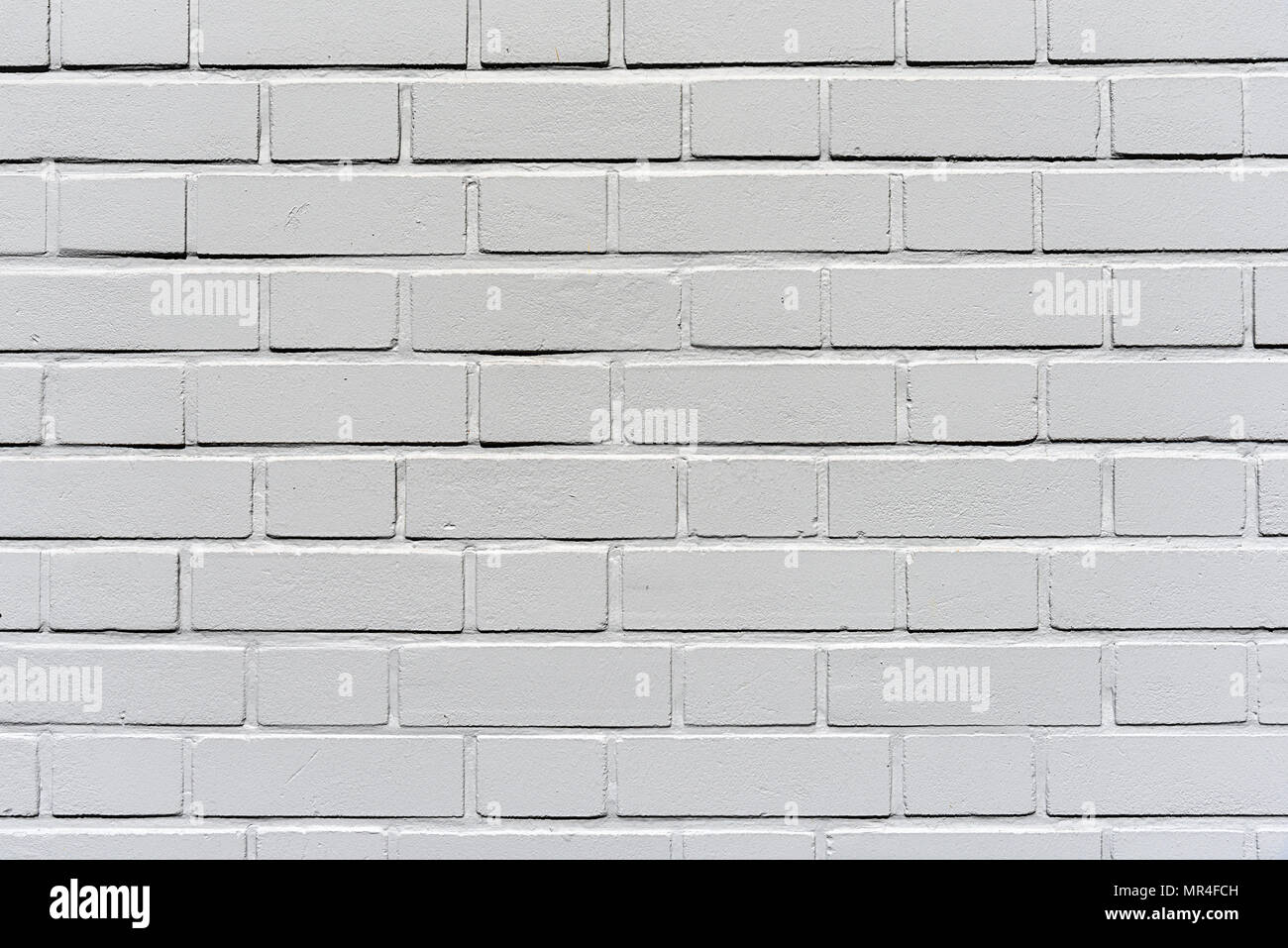 Arrière-plan d'un mur en brique de plâtre gris Banque D'Images
