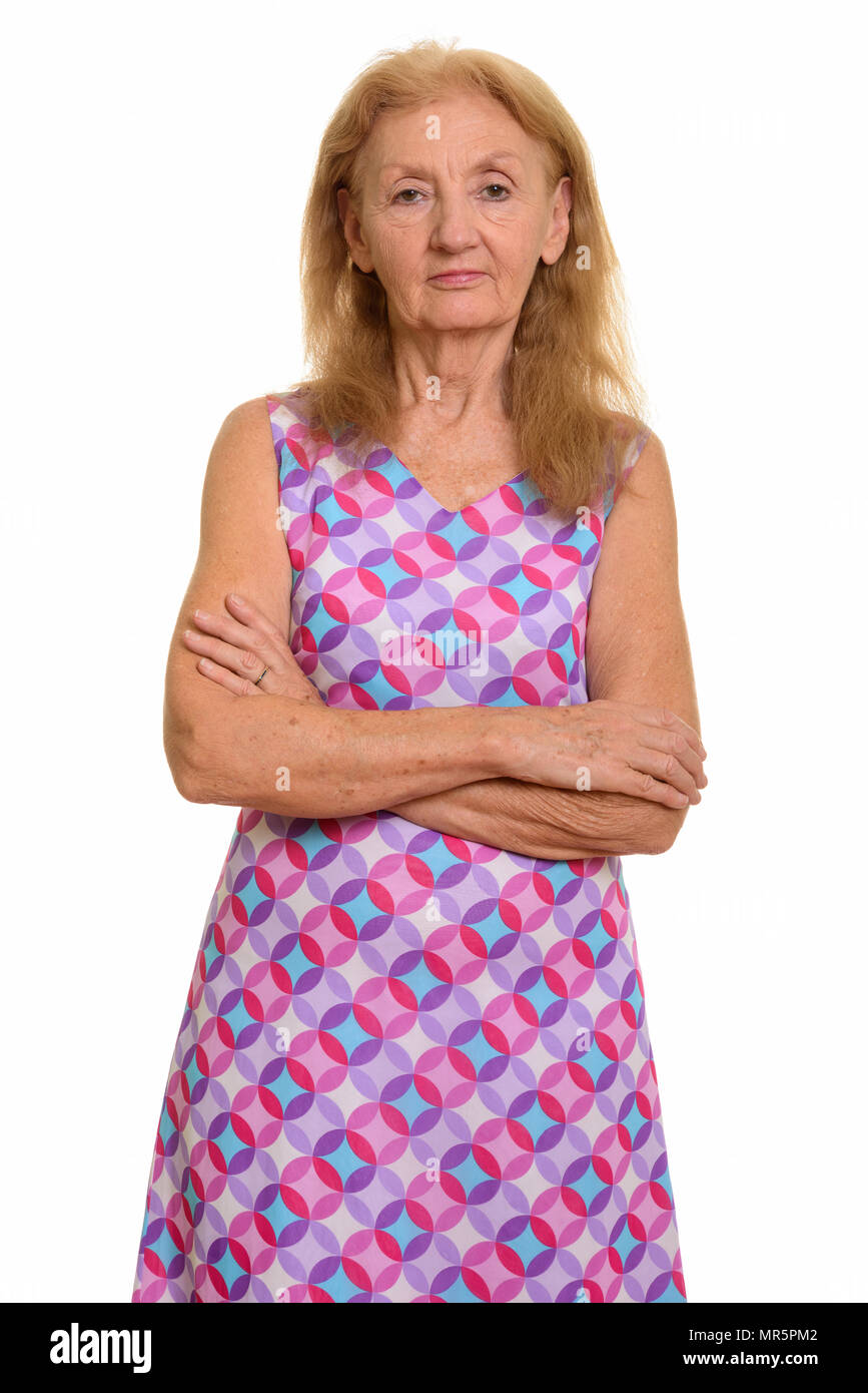 Studio shot of senior woman with arms crossed Banque D'Images
