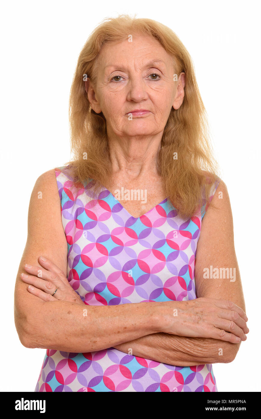 Studio shot of senior woman with arms crossed Banque D'Images