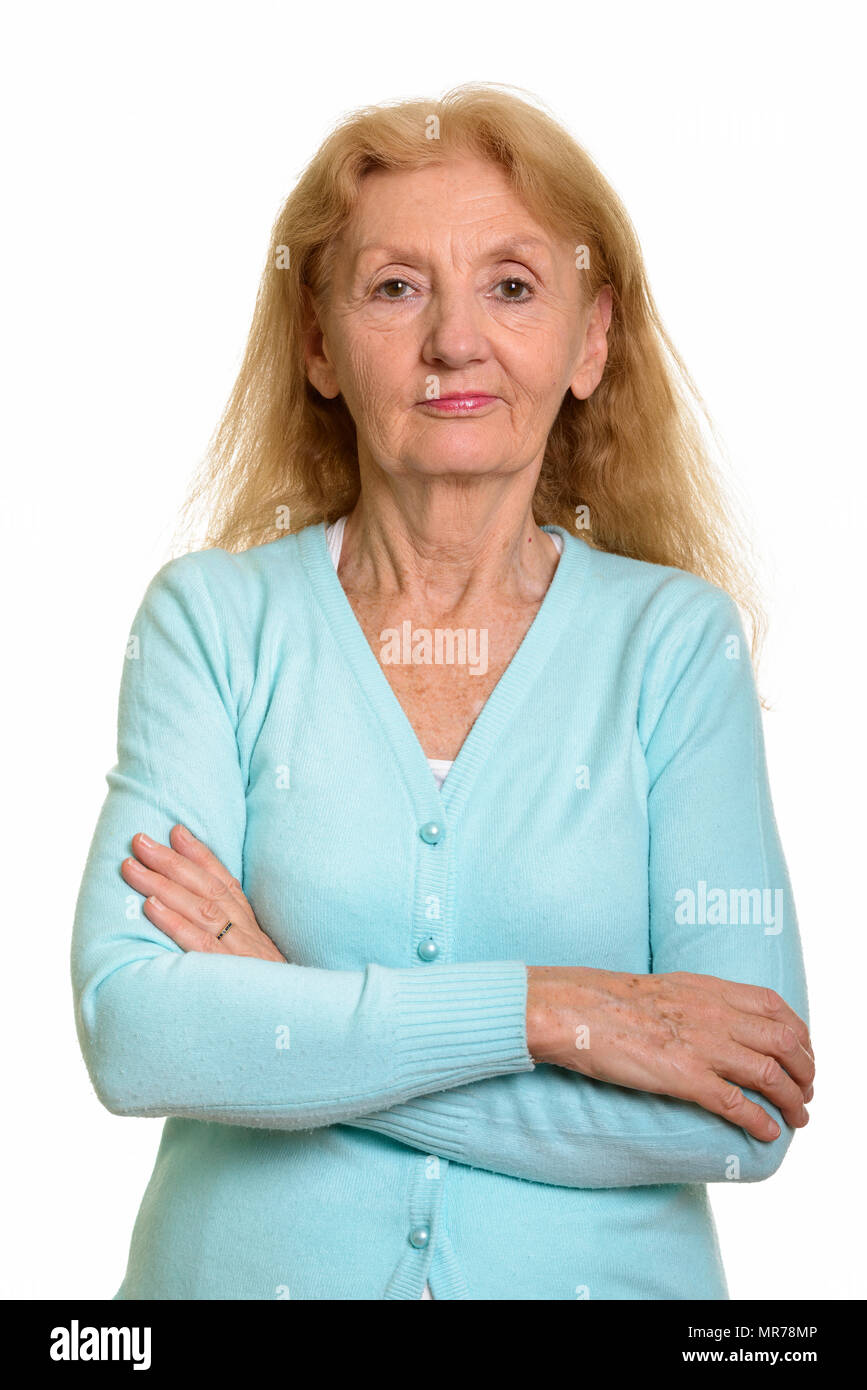 Studio shot of senior woman with arms crossed Banque D'Images