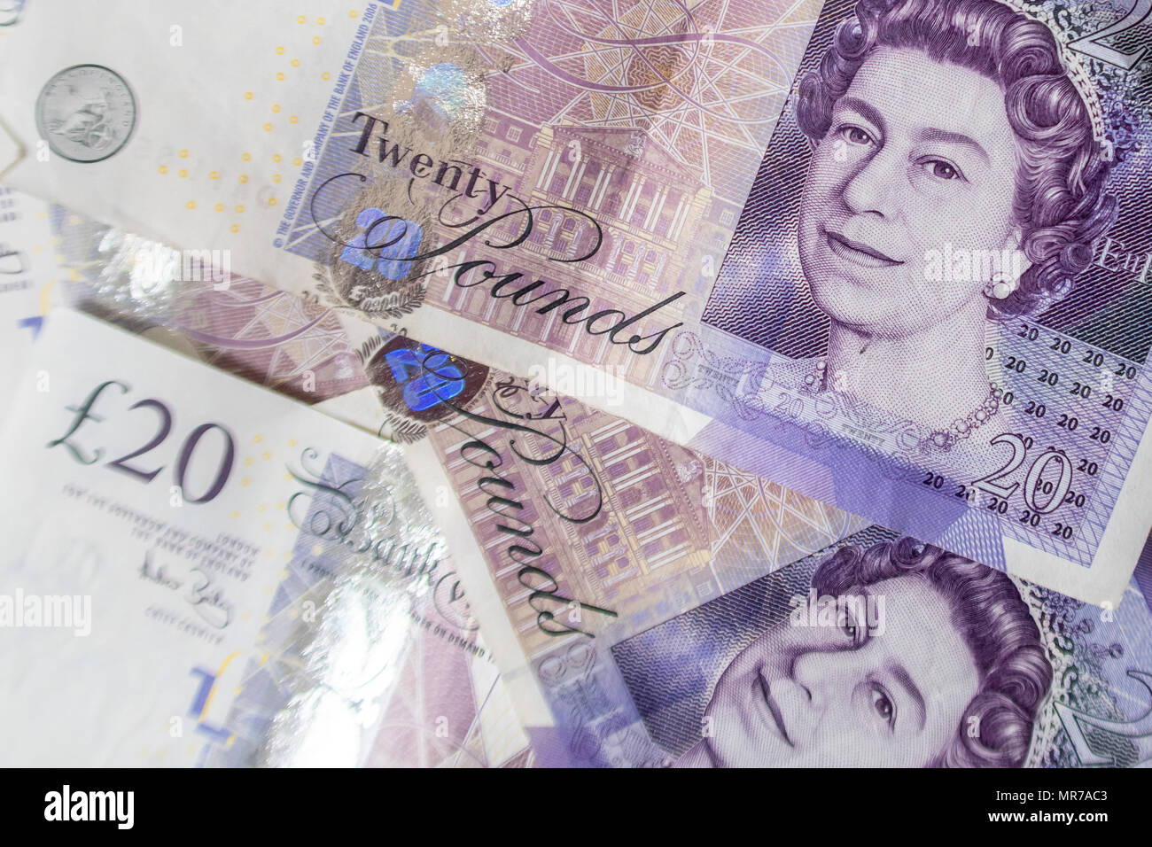 Arrière-plan d'un grand tas de vingt livres sterling pound bank notes Banque D'Images