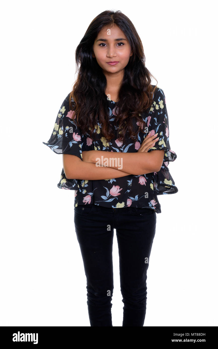 Studio shot of young Beautiful woman standing with arms persan Banque D'Images