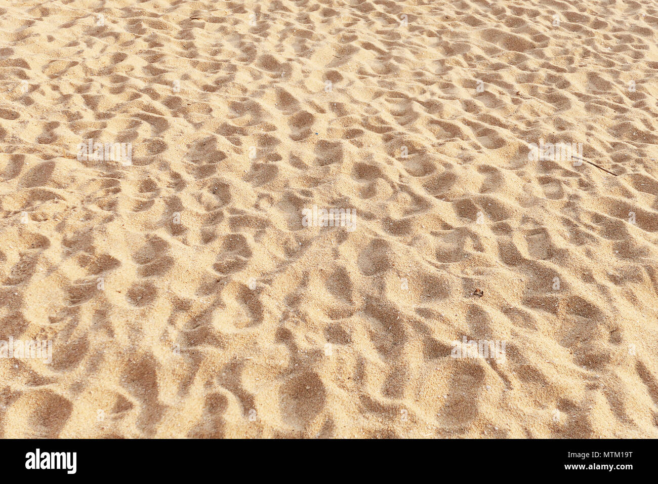 Le sable de plage tropicale comme arrière-plan Banque D'Images