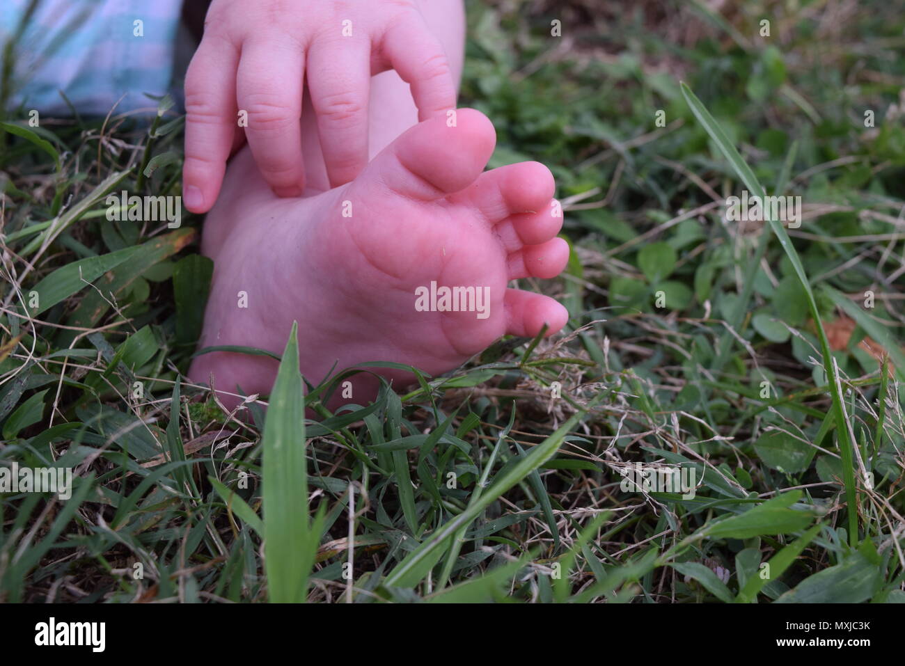 Baby foot et hand Banque D'Images