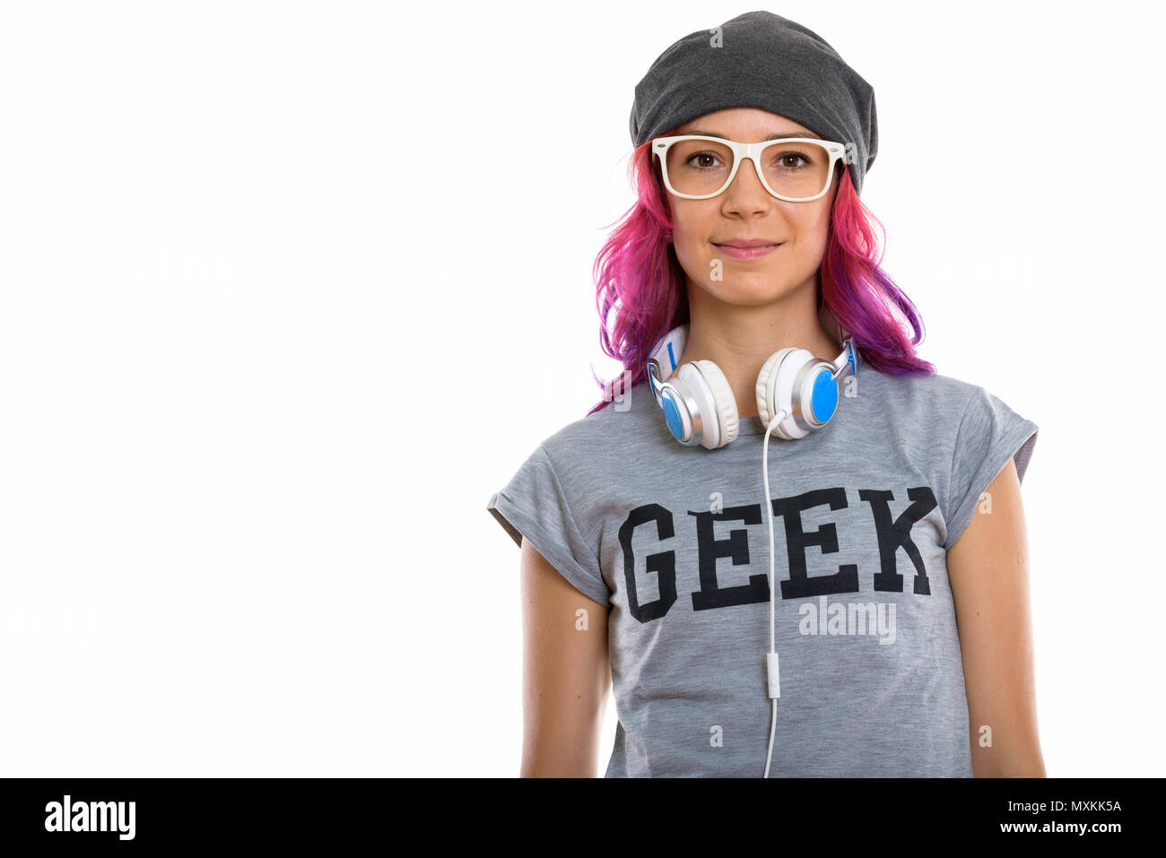 Studio shot of geek girl wearing eyeglasses with headphones arou Banque D'Images