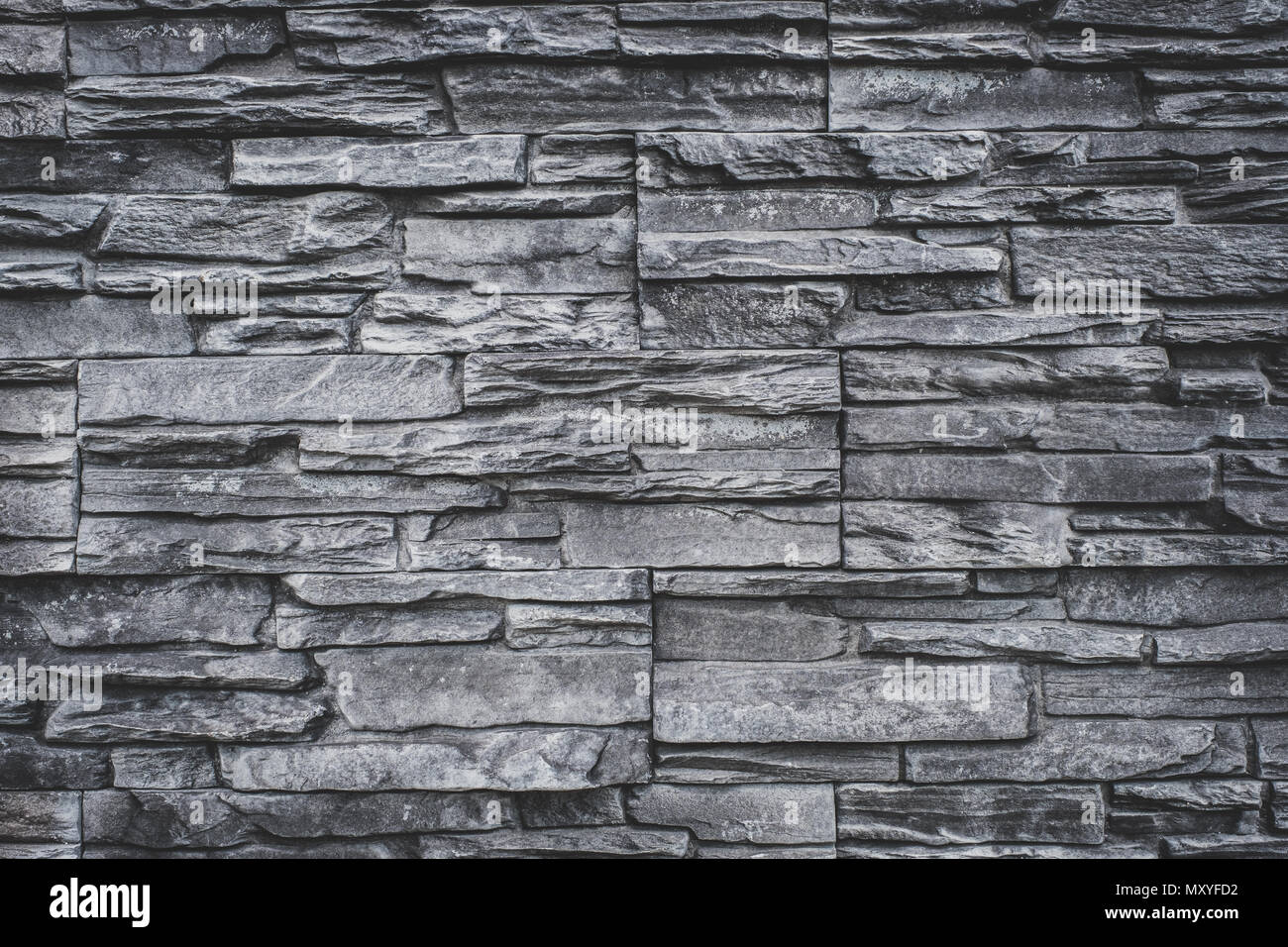 Mur en pierres naturelles - pierre de granit gris fond texture - sol carrelé de dalles en pierre naturelle pour intérieur Banque D'Images