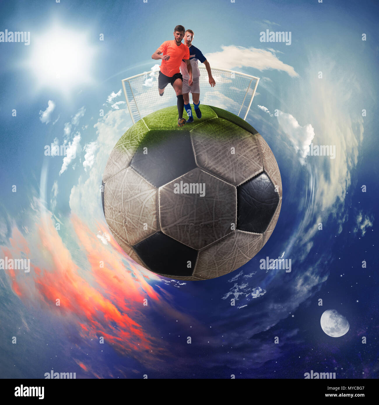 Les joueurs de football dans un ballon de foot planète Banque D'Images