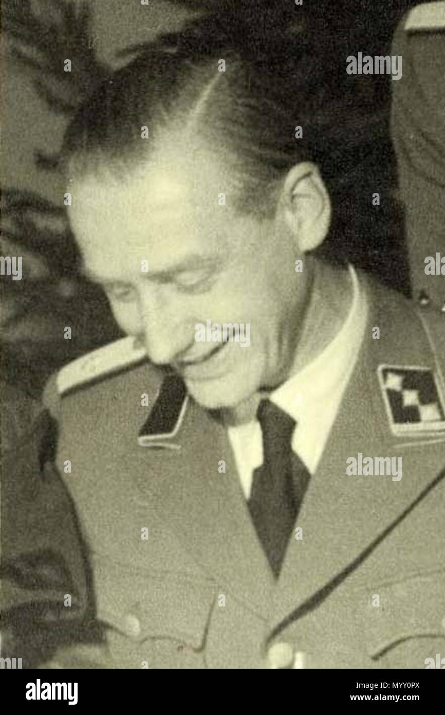 . Anglais : criminel de guerre allemand Ferdinand aus der Fünten (1909-1989) (en bas à droite), deux autres officiers SS (Gemmeker & Hassel) et M. Scheltnes. Camp Westerbork, 'Bal' (près de Noël), 1942. Nederlands : Kerstmis à Westerbork, 'Joelfeest' 1942. Van Kampcommandant liens naar rechts : Obersturmführer SS Albert Konrad Gemmeker, SS untersturmführer Hassel, SS Hauptsturmführer aus der Fünten en Scheltnes van de firma Lippmann Rosenthal & Co . Décembre 1942. Rudolf Breslauer 39 Gemmeker (rognée) Banque D'Images