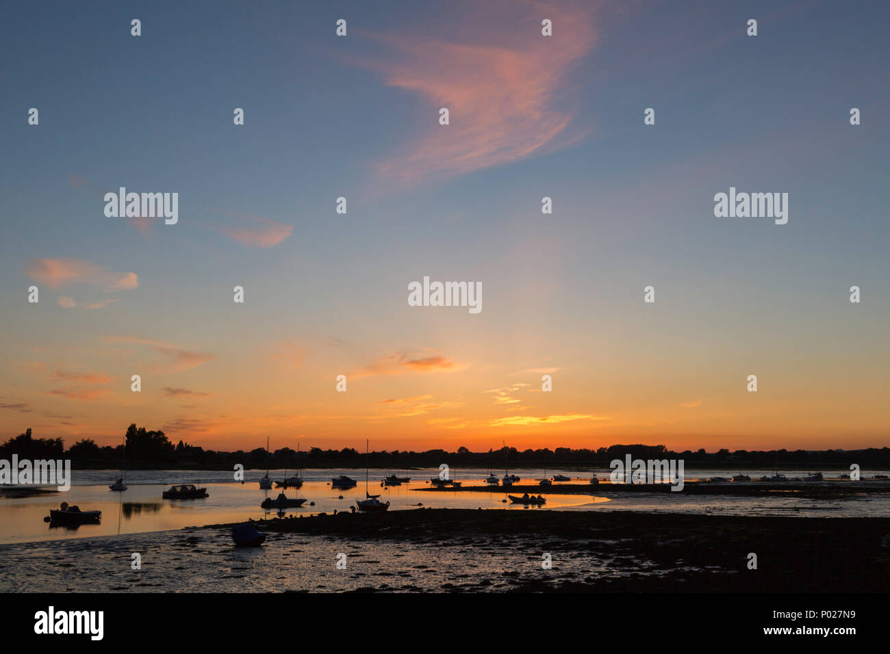 Coucher du soleil à Bosham quai dans le port de Chichester, West Sussex, UK. Banque D'Images