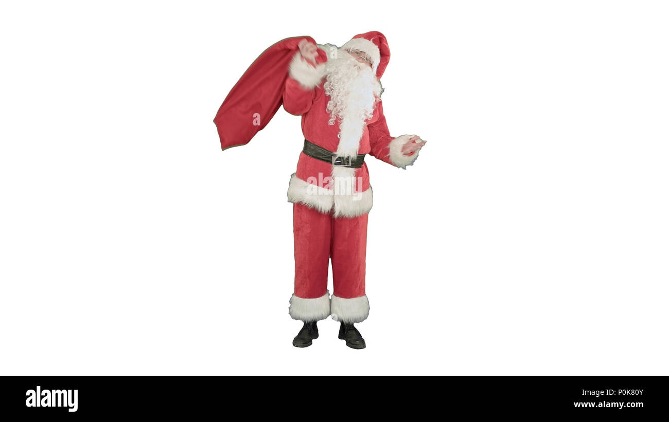 Vrai Père Noël exerçant son gros sac plein de cadeaux sur fond blanc Banque D'Images