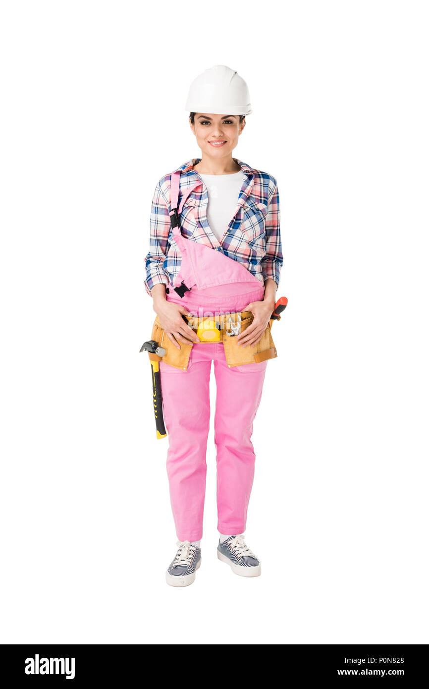 Cheerful female construction worker en uniforme rose isolated on white Banque D'Images