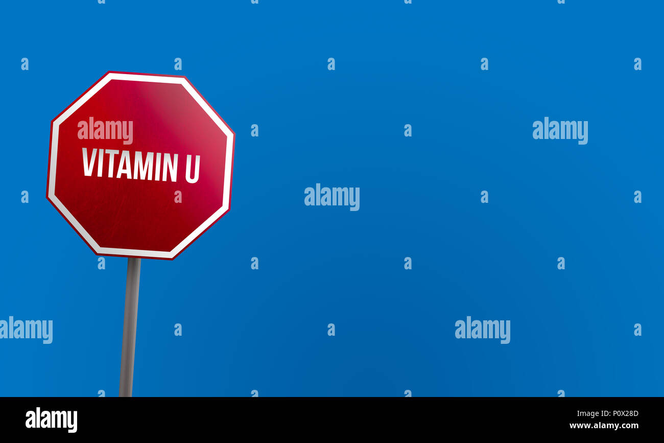 La vitamine U - panneau rouge avec ciel bleu Banque D'Images