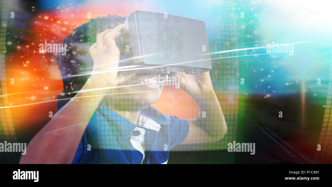 Image composite de boy wearing simulateur de réalité virtuelle Banque D'Images