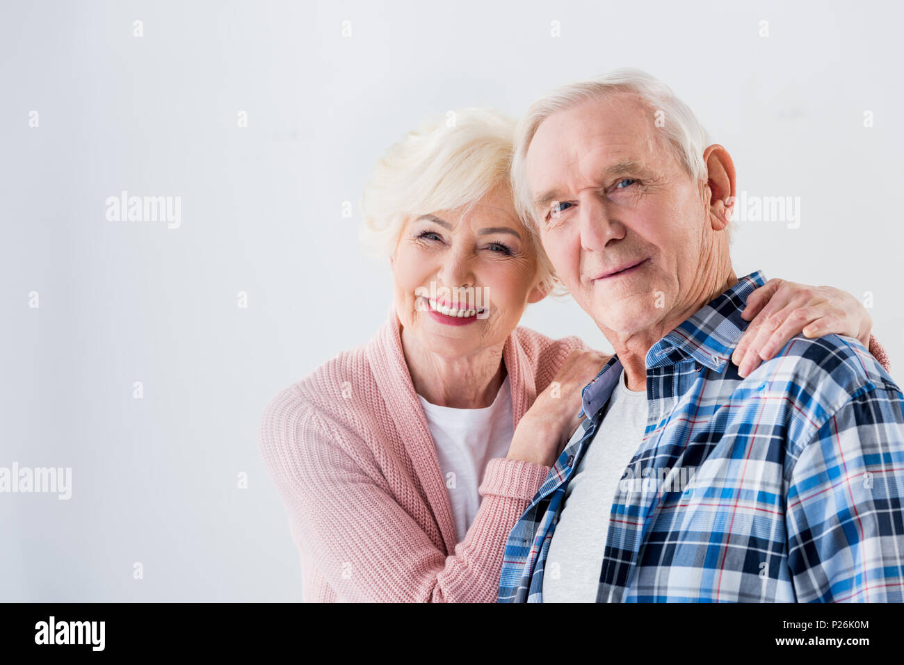 Portrait of happy senior couple looking at camera Banque D'Images
