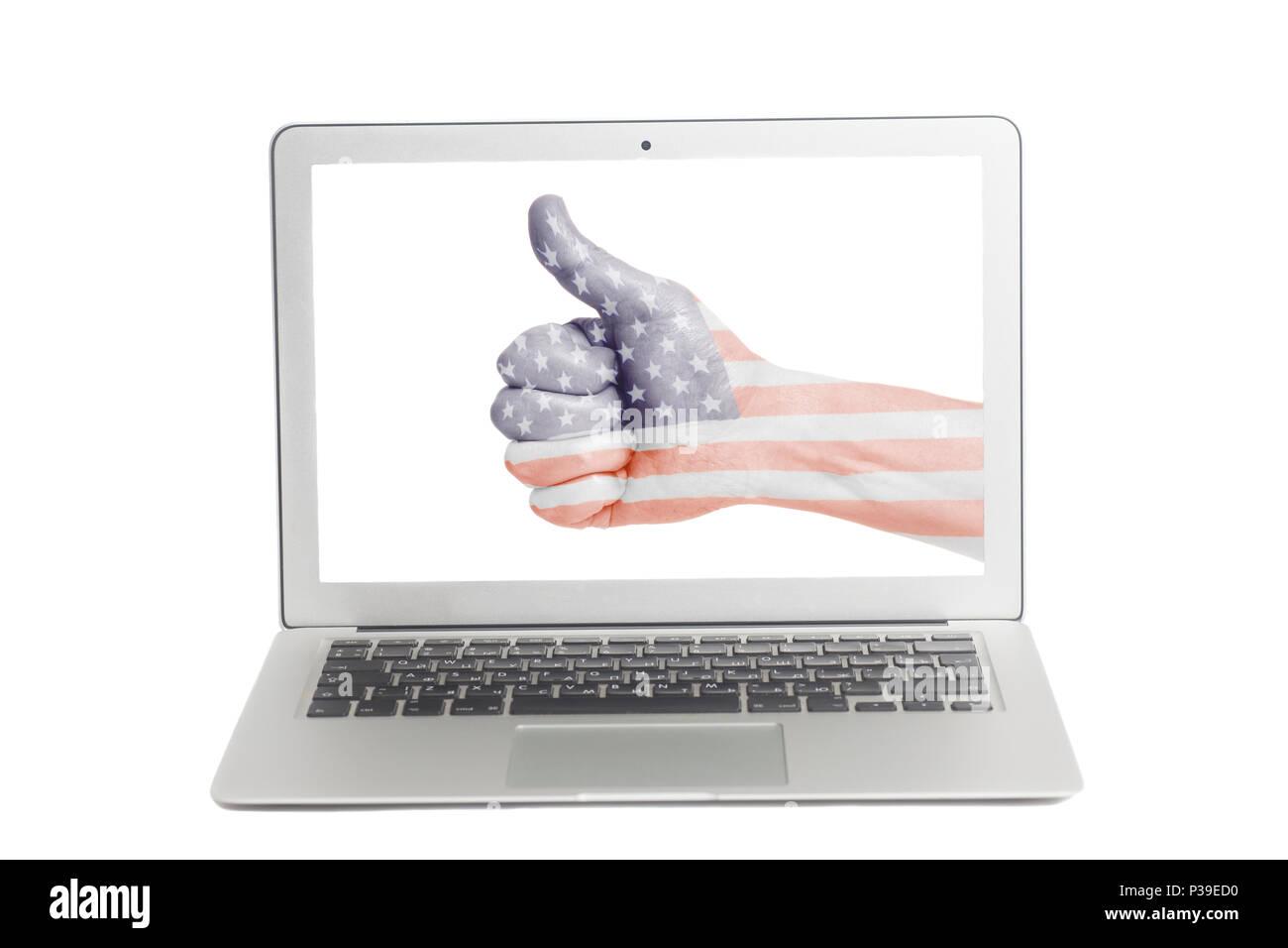 Ordinateur portable avec USA flag painted on hand showing Thumbs up sur l'écran vide Banque D'Images