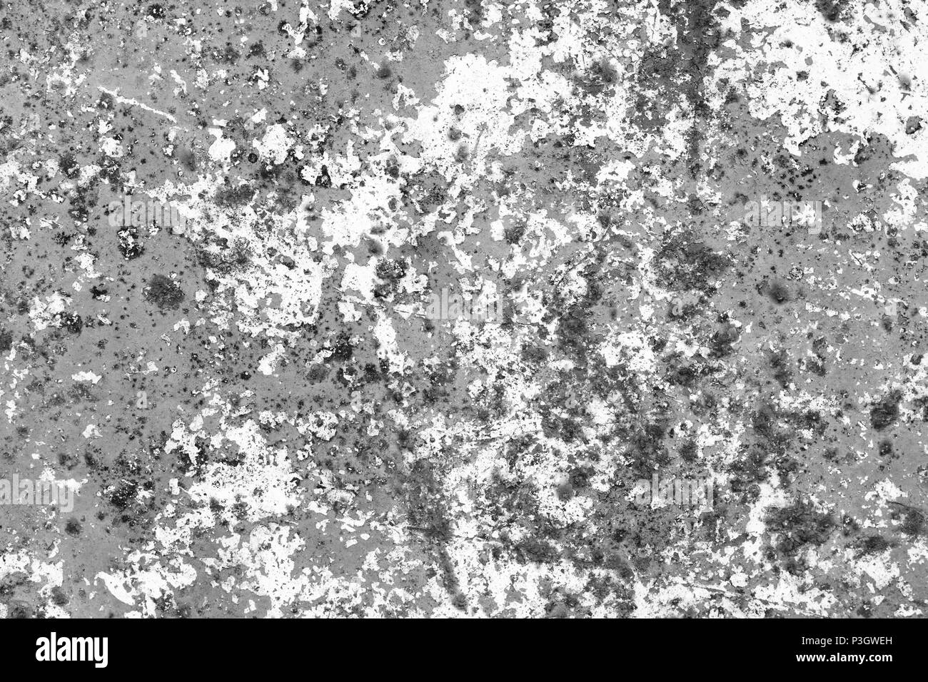 Texture grunge fissuré de vieux mur avec des fissures et des points de rouille. Noir et blanc fond rugueux. Banque D'Images