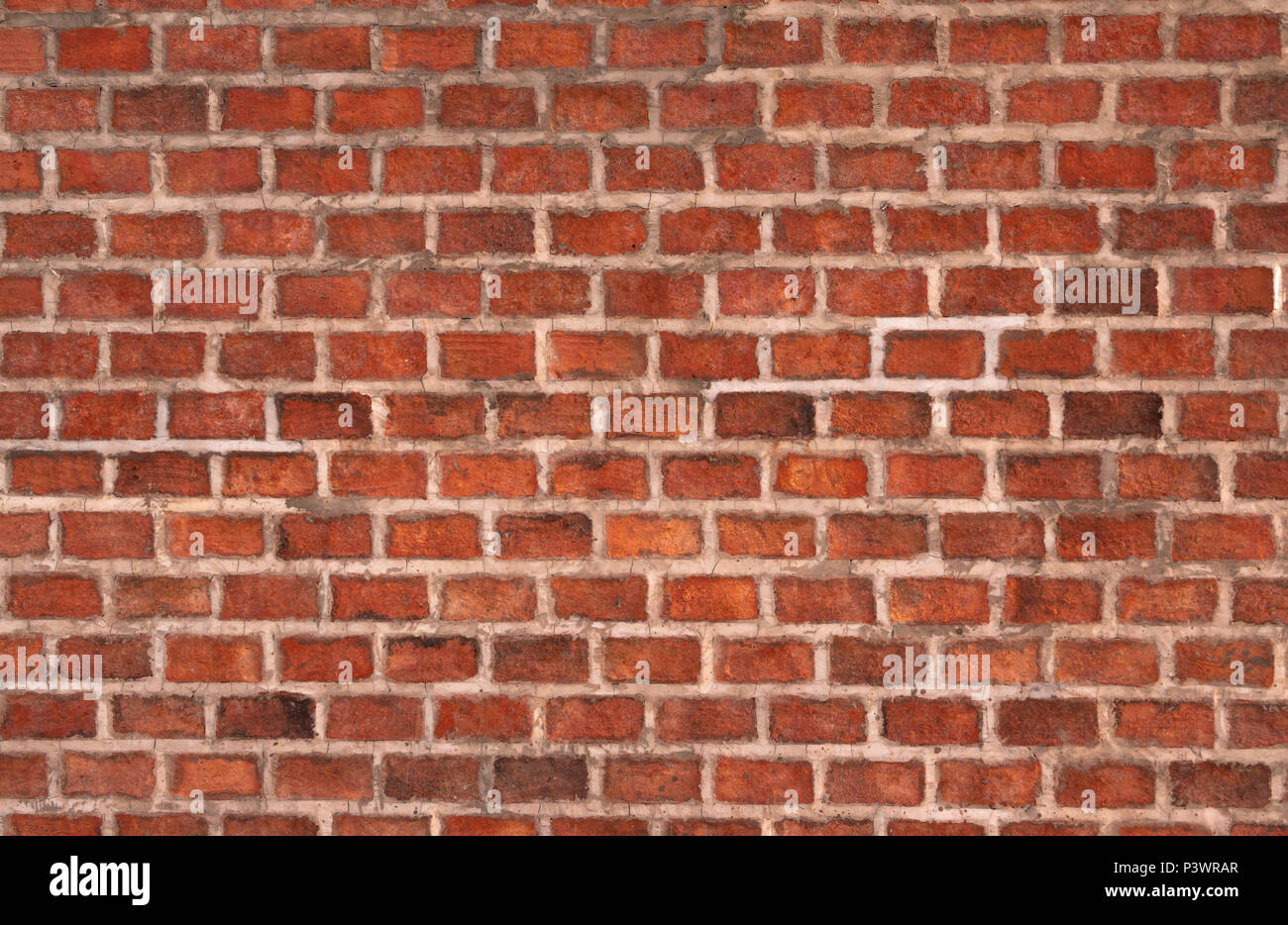 Mur de brique orange fait de briques et de ciment. Mur texture background Banque D'Images