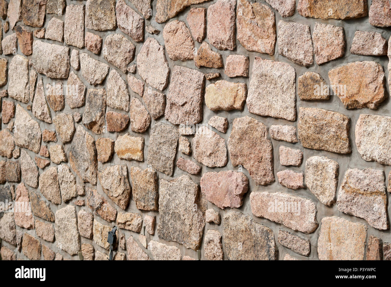 Mur en pierre de granit rouge Banque D'Images