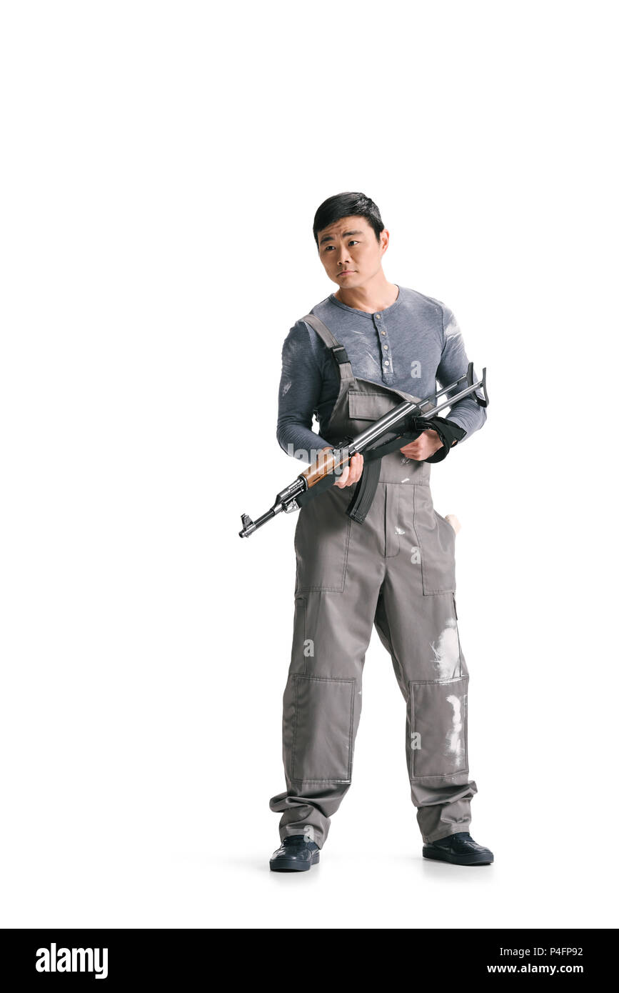 Dans l'ensemble asiatique sale terroriste au fusil isolated on white Banque D'Images