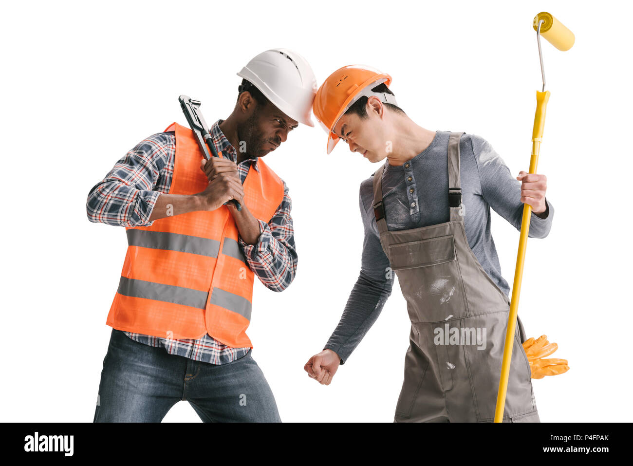 Confrontation des africains-américains et asiatiques builders isolated on white Banque D'Images