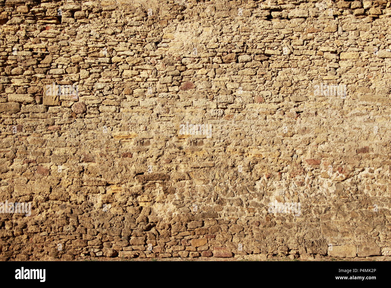 La texture d'un ancien mur de pierre Banque D'Images