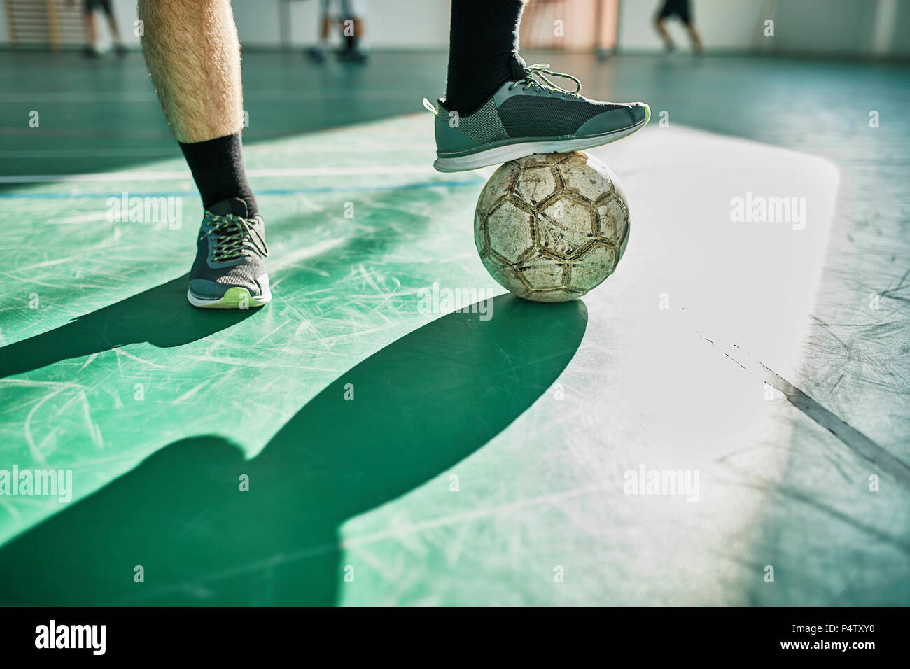 Close-up of indoor soccer player with ball Banque D'Images