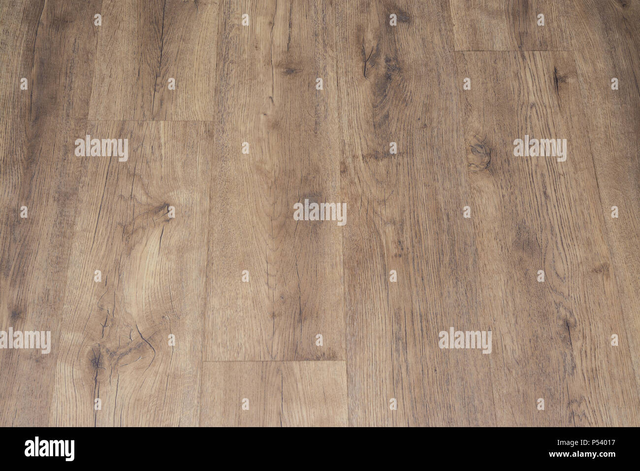 En vinyle, moderne avec du vieux bois imitation. Close-up de nouveau parquet beige avec la texture de 600x600 avec grains brun et noeuds. L'arrière-plan décoratif. Banque D'Images