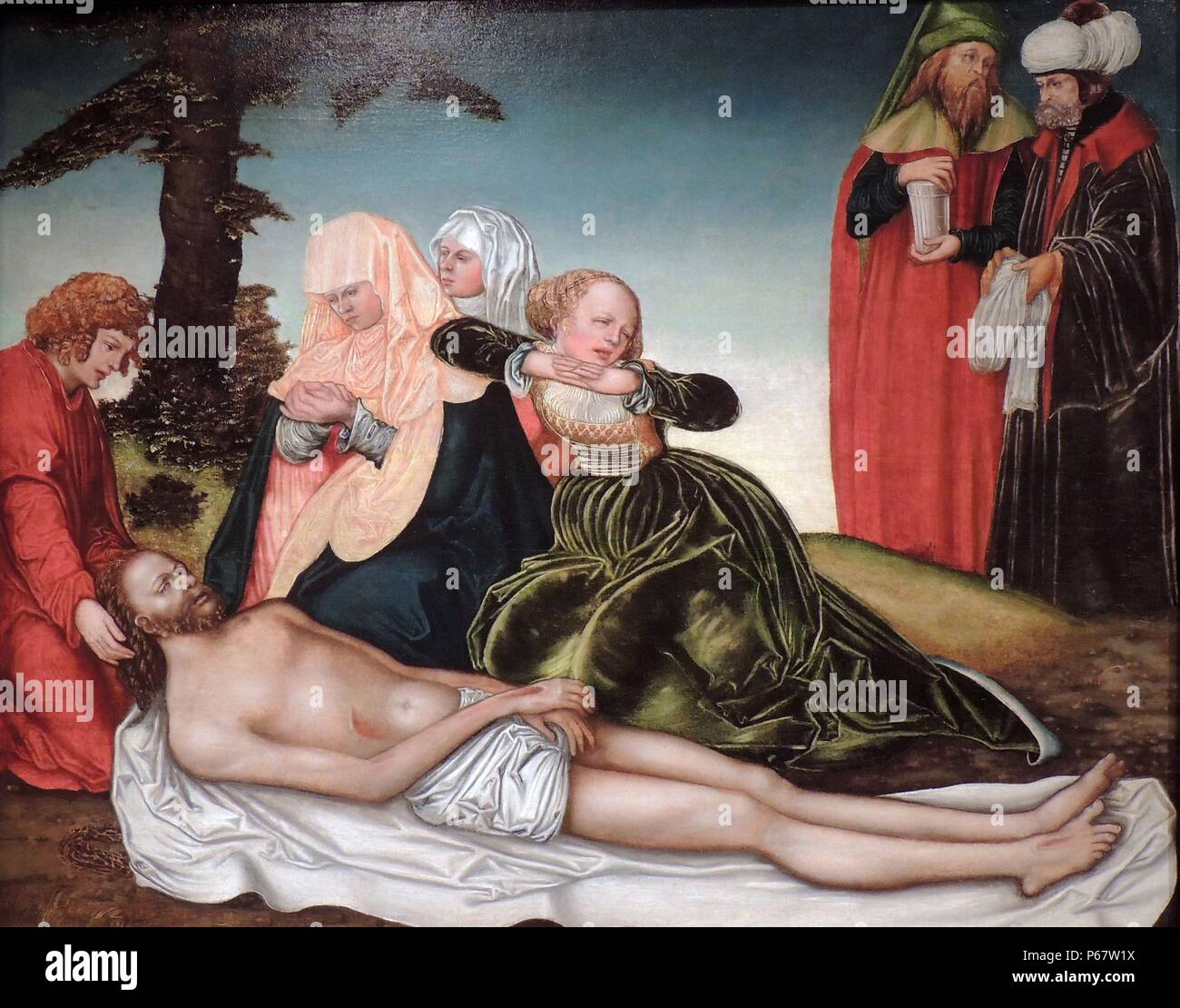 La lamentation, c 1518 par Lucas Cranach le Vieux (1472-1553). Cette peinture représente les moments après le Christ était descendu de la croix. Son corps allongé remplit la moitié inférieure de la photo et son expression est gelée dans un vague regard torturé. St Jean l'Évangéliste est illustré, berçant la tête du Christ, aux côtés de la Vierge Marie et Marie Madeleine. Joseph d'Arimathée est dans l'arrière-plan. Il a obtenu la permission de les Romains de prendre le corps du Christ. Banque D'Images