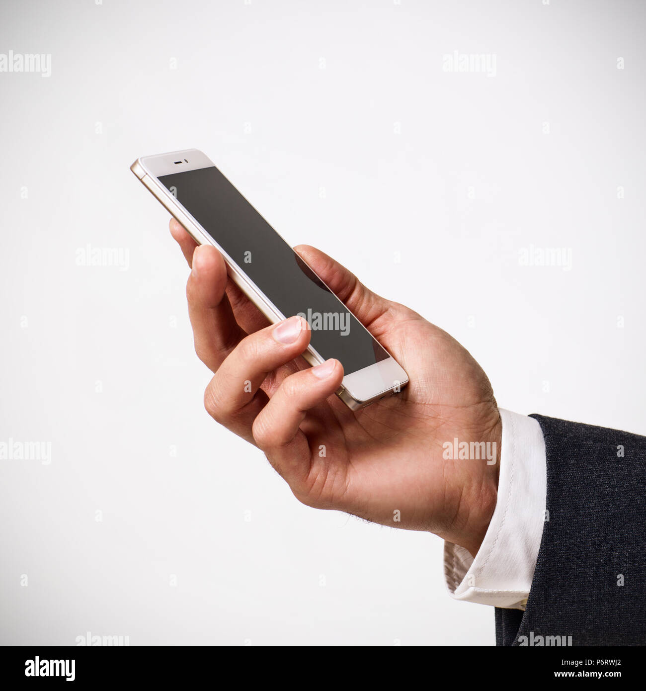Hand holding white Smartphone avec écran vide Banque D'Images