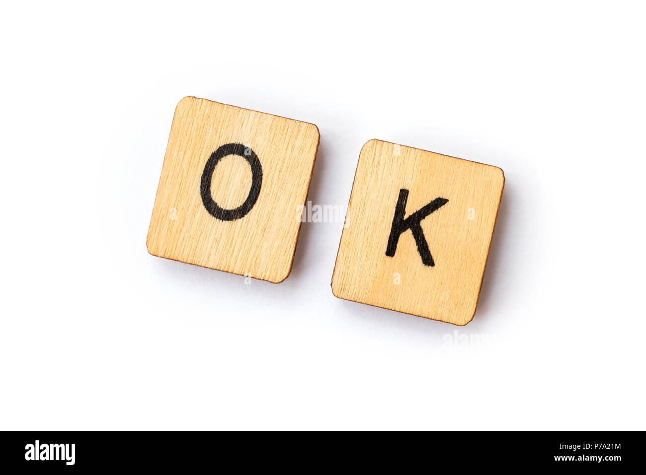 Le mot OK précisées par des lettres en bois avec des carreaux. Banque D'Images