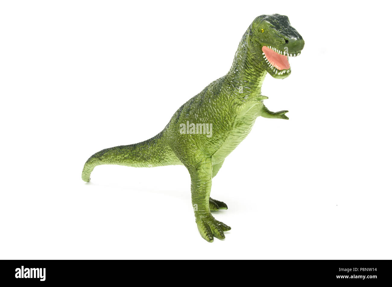 L'avant du vert en plastique jouet dinosaure Tyrannosaurus rex, isolé sur un fond blanc. Banque D'Images