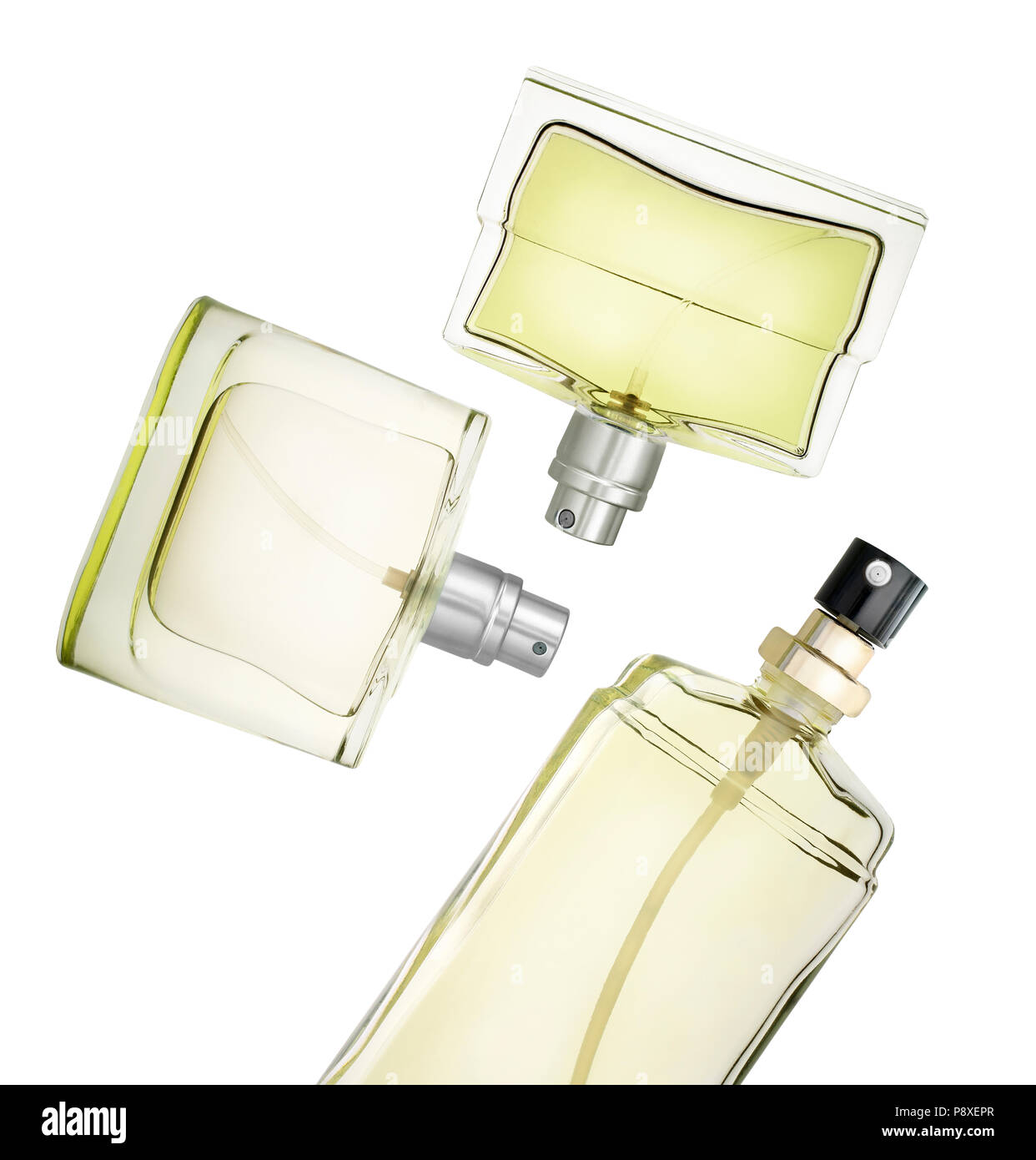 Flacons de parfum floating contre fond blanc. Clipping path Banque D'Images