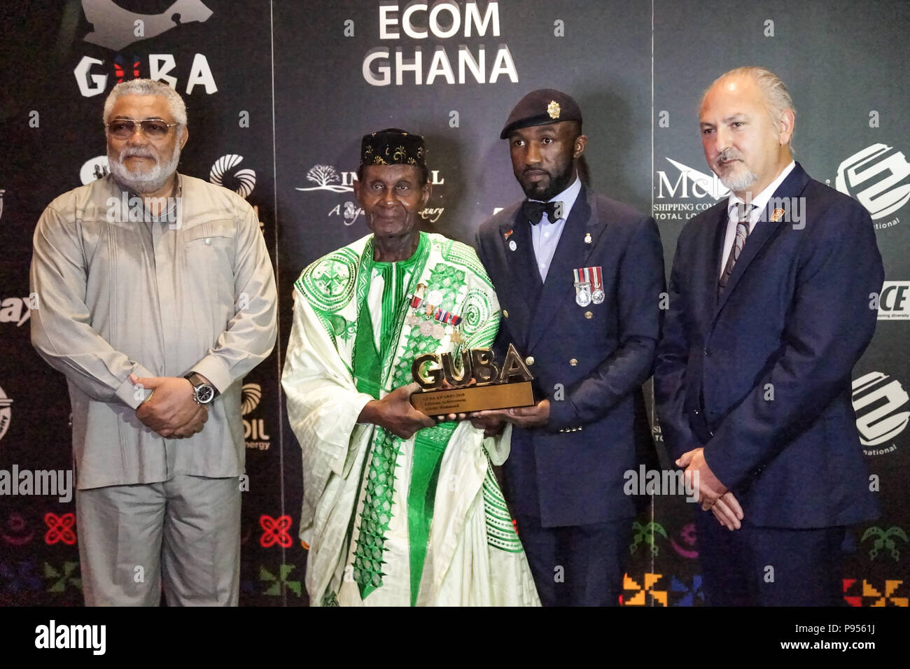 14 juillet 2018. Londres, Angleterre. L À R., ancien Président du Ghana, Jerry John Rawkings, Joshua Ashitey Hammond, Derrick Cobbinah, Fausto Gottardo.Stormzy entre Lauréats GUBA Awards à Londres. GUBA (Ghana UK Base) a eu lieu à l'O2 Intercontinental Hotel, North Greenwich, Londres. L'ancien Président du Ghana, Jerry John Rawlings, a parlé et a donné des bourses d'autres sommités seront notamment la réalisatrice Amma Asante Pedersen, Hugh Quarshie, George Boateng, Nana Abu Anamoah Buatsi, Joshua. © Peter Hogan/Alamy Live News Banque D'Images