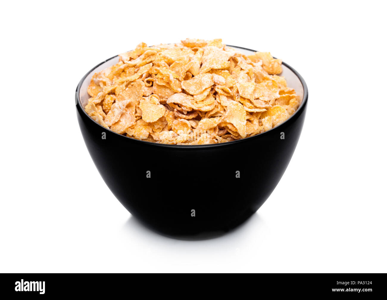 Bol noir avec les matières organiques naturelles corn flakes céréales  granola on white Photo Stock - Alamy