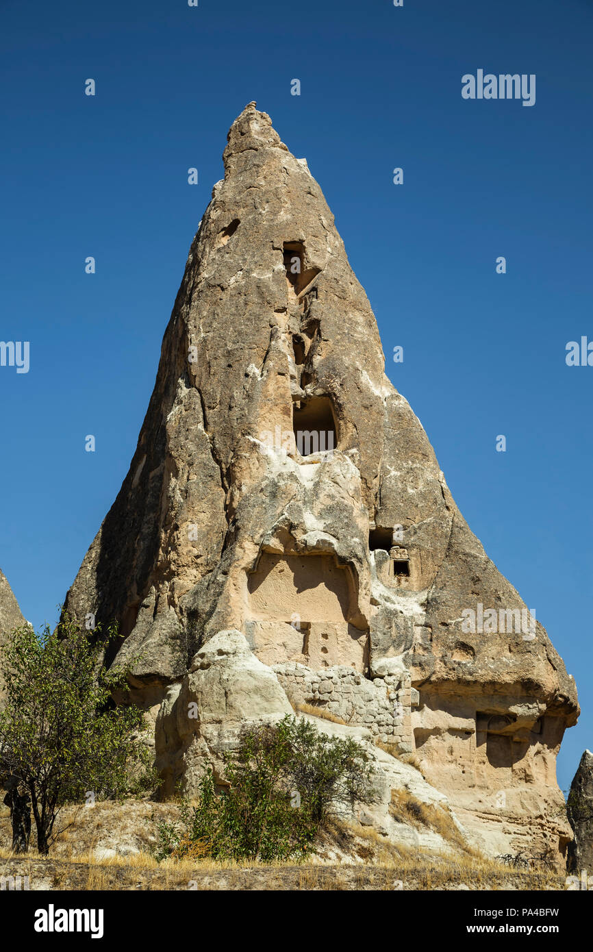 Logements en cheminées de fées, Goreme, Cappadoce, Turquie Banque D'Images