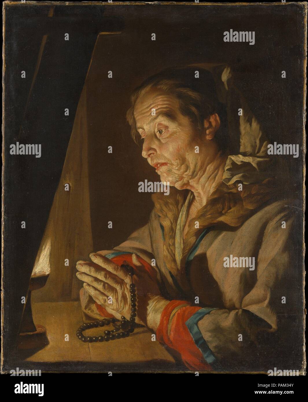 Vieille Femme en prière. Artiste : Matthias Stom (Néerlandais, Amersfoort ?, né ca. 1599-1600, est mort après 1652  ?l'Italie). Dimensions : 30 5/8 x 25 1/8 in. (77,8 x 63,8 cm). Date : fin des années 1630 ou au début des années 1640. La première référence connue à Stom (appelé à tort dans la littérature moderne Stomer) remonte à 1630, lorsqu'il vivait dans la même maison à Rome que le peintre Utrecht Paulus Bor occupé environ cinq ans plus tôt. Environ 1632 Stom est allé à Naples, et dans les années 1640, il est actif à Palerme en Sicile et ailleurs. Antonio Ruffo, le noble à Messine pour lesquels Rembrandt a peint  <i >Aristote avec un buste d'H Banque D'Images