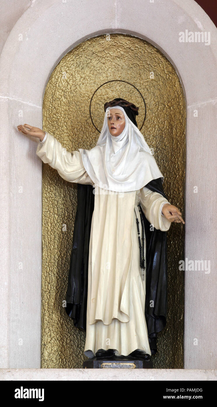 Sainte Catherine de Sienne, statue sur l'autel principal dans l'église du monastère de l'Ange Gardien à l'île de Korcula, Korcula, Croatie Banque D'Images