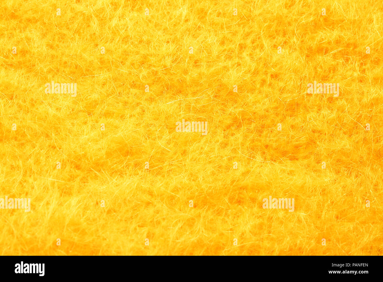 Fourrure artificielle jaune texture background Banque D'Images