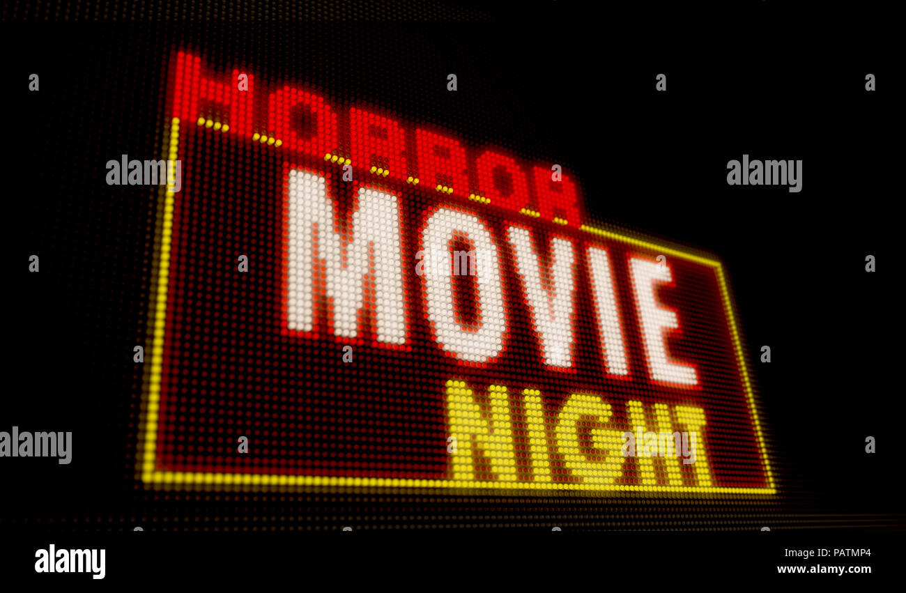 Horror movie night retro éclairé intro lettres sur grand écran néon avec de gros pixels. La lumière vive du texte sur l'affichage des ampoules. Événement de divertissement adve Banque D'Images