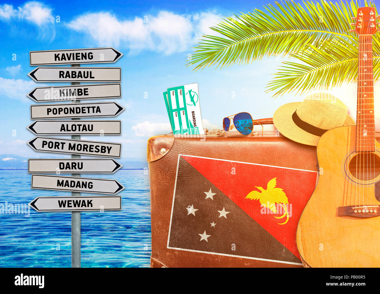 Concept de l'été à voyager avec vieille valise et la Papouasie-Nouvelle-Guinée le panneau de la commune Banque D'Images