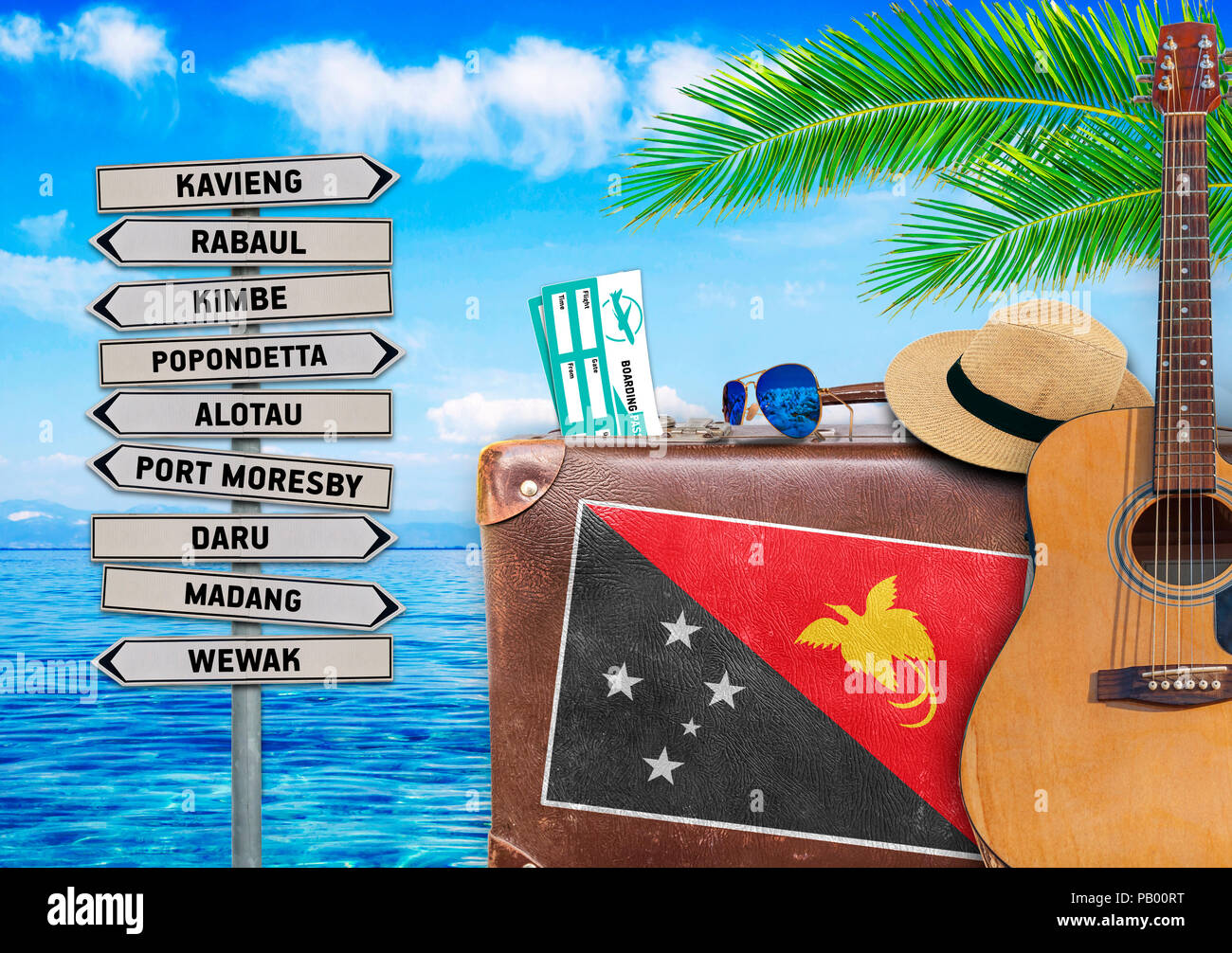 Concept de l'été à voyager avec vieille valise et la Papouasie-Nouvelle-Guinée le panneau de la commune Banque D'Images