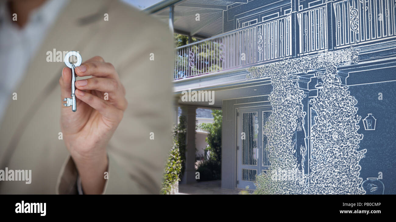 Image composite de mid section de montrant house key Banque D'Images